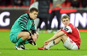 Images Dated 27th February 2011: Wojciech Szczesny and Jack Wilshere (Arsenal) dejected after the matc. Arsenal 1