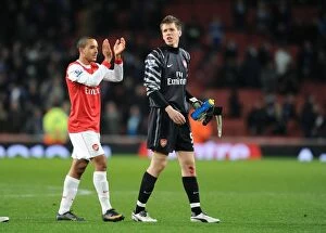 Images Dated 25th January 2011: Wojciech Szczesny and Theo Walcott (Arsenal) claps the fans at the end of the match