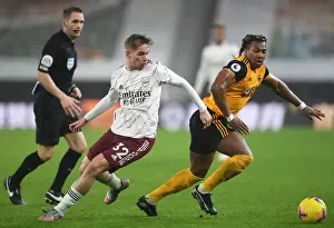 Wolverhampton Wanderers V Arsenal 2020-21 Prints: Wolverhampton Wanderers vs Arsenal: Intense Battle between Emile Smith Rowe and Adama Traore in the Premier League