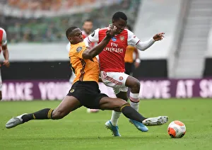 Wolverhampton Wanderers V Arsenal 2019-20 Prints: Wolverhampton Wanderers vs. Arsenal: Nketiah vs. Boly Battle in Premier League Clash