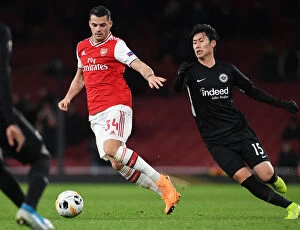 Images Dated 28th November 2019: Xhaka Breaks Past Eintracht Frankfurt: Arsenal's Europa League Battle