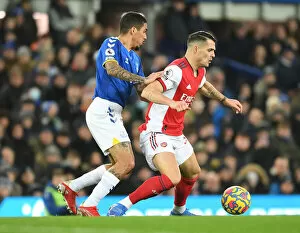 Images Dated 6th December 2021: Xhaka Fouls Allan: Intense Moment from Everton vs. Arsenal Premier League Clash (2020-21)