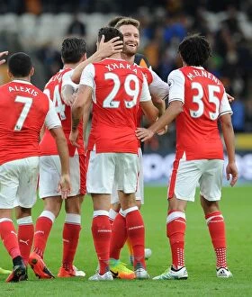 Images Dated 17th September 2016: Xhaka and Mustafi: Celebrating Arsenal's Fourth Goal Against Hull City (2016-17)