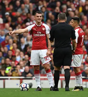 Arsenal V Brighton And Hove Albion 2017-18 Prints: Xhaka and Referee Share a Light-Hearted Moment Amidst Arsenal's Battle Against Brighton