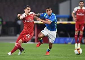 Napoli V Arsenal 2018-19 Prints: Xhaka vs Allan: A Fierce Battle in the Europa League Showdown between Napoli and Arsenal