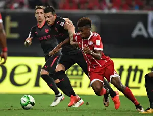 Bayern Munich V Arsenal 2017-18 Prints: Xhaka vs Coman: Battle in Shanghai - Bayern Munich vs Arsenal Pre-Season Clash