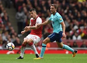 Arsenal v AFC Bournemouth 2017-18 Collection: Xhaka vs. Gosling: Intense Battle in Arsenal v AFC Bournemouth Premier League Clash