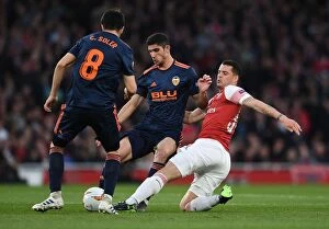 Images Dated 2nd May 2019: Xhaka vs Guedes: A Midfield Showdown in Arsenal's Europa League Battle with Valencia
