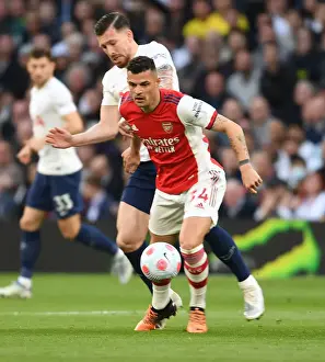 Tottenham Hotspur V Arsenal 2021-22 Prints: Xhaka vs. Hojbjerg: Intense Rivalry in the Premier League Clash Between Tottenham and Arsenal