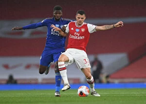 Arsenal v Leicester City 2019-20 Collection: Xhaka vs Iheanacho: A Premier League Battle at Emirates Stadium