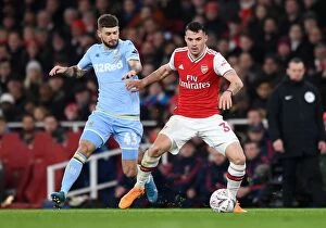 Arsenal v Leeds United FA Cup 2019-20 Collection: Xhaka vs Klich: A Midfield Battle in Arsenal's FA Cup Clash against Leeds United