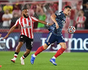 Brentford V Arsenal 2021-22 Prints: Xhaka vs Mbeumo: A Premier League Battle - Arsenal's Xhaka Clashes with Brentford's Mbeumo (2021-22)