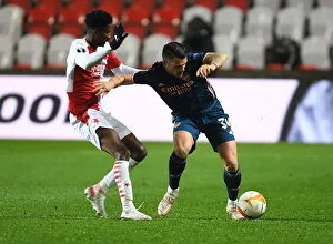 Xhaka vs. Olayinka Showdown: Empty Europa League Arena, Prague - Arsenal's Battle Against Slavia