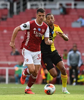 Images Dated 26th July 2020: Xhaka vs. Pedro: A Battle of Midfield Titans in Arsenal's Premier League Clash
