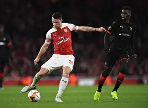 Arsenal V Stade Rennais 2018-19 Prints: Xhaka vs Sarr: Battle in the Europa League Clash Between Arsenal and Stade Rennais