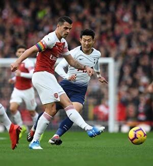 Images Dated 2nd December 2018: Xhaka vs. Son: Intense Battle in the Midfield - Arsenal vs. Tottenham, Premier League 2018-19