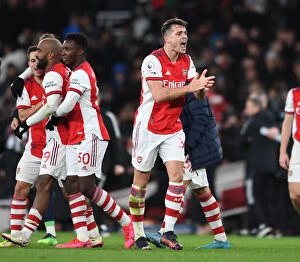 Images Dated 24th February 2022: Xhaka's Euphoric Celebration: Arsenal Secures Premier League Victory over Wolverhampton Wanderers