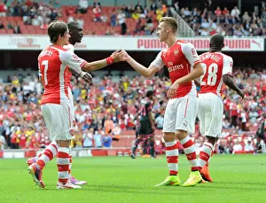Yaya Sanogo celebrates scoring his 2nd goal with Tomas Rosicky and Calum Chambers