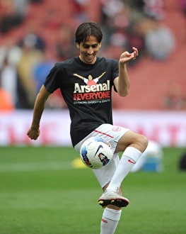 Yossi Benayoun (Arsenal) warms up in his Arsenal for Everyone T Shirt Yossi Benayoun (Arsenal) warms up in his Arsenal for Everyone T Shirt