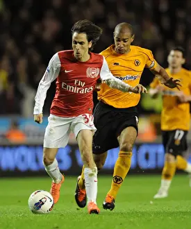 Wolverhampton Wanderers V Arsenal 2011-12 Prints: Yossi Benayoun vs. Carl Henry: Intense Rivalry at Molineux - Arsenal vs