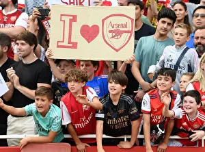 Young Arsenal Fans Celebrate Emirates Cup Victory over Sevilla