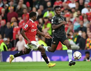 Manchester United V Arsenal 2022-23 Prints: Young Stars Clash: Nketiah vs Malacia in Manchester United vs Arsenal Premier League Showdown (2022-23)