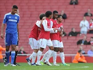 Zak Ansah celebrates scoring Arsenals goal with Phillip Roberts and Serge Gnabry